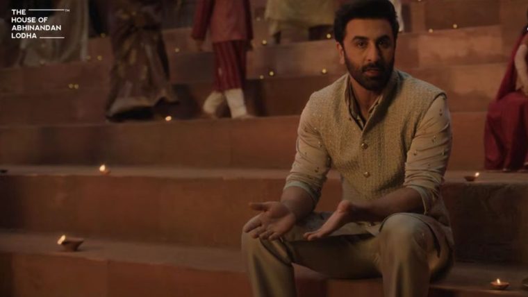 Ranbir Kapoor in traditional Indian attire, standing in a serene Ayodhya setting, promoting The Sarayu project.