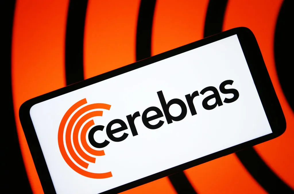 A close-up image of a Cerebras Systems AI chip wafer, showing intricate circuitry and advanced design.