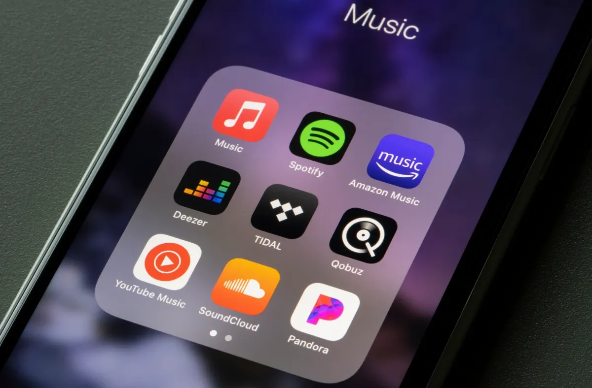A screenshot of the Deezer AI music detector interface showing a playlist being scanned for AI-generated tracks.