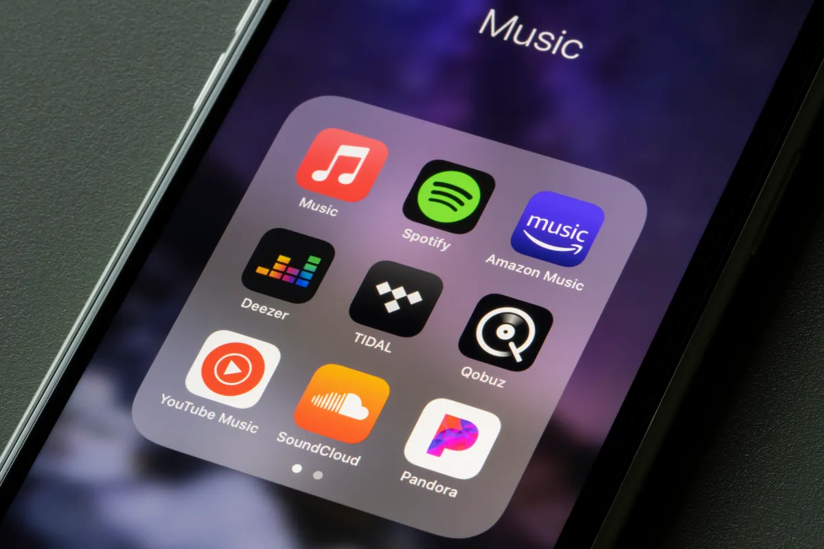 A screenshot of the Deezer AI music detector interface showing a playlist being scanned for AI-generated tracks.
