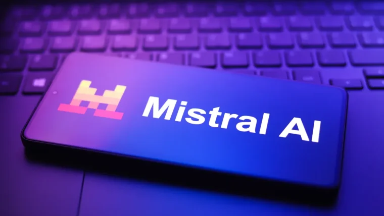 The Mistral AI company logo displayed prominently, with a blurred background of a modern office space, symbolizing innovation and growth in artificial intelligence.