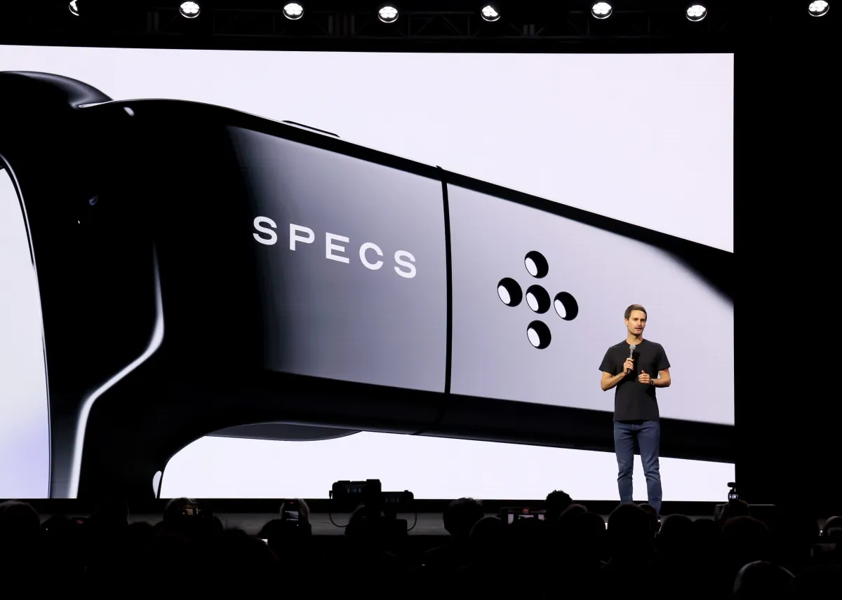 Logo of Snap and an abstract representation of AI-generated video or interactive gaming