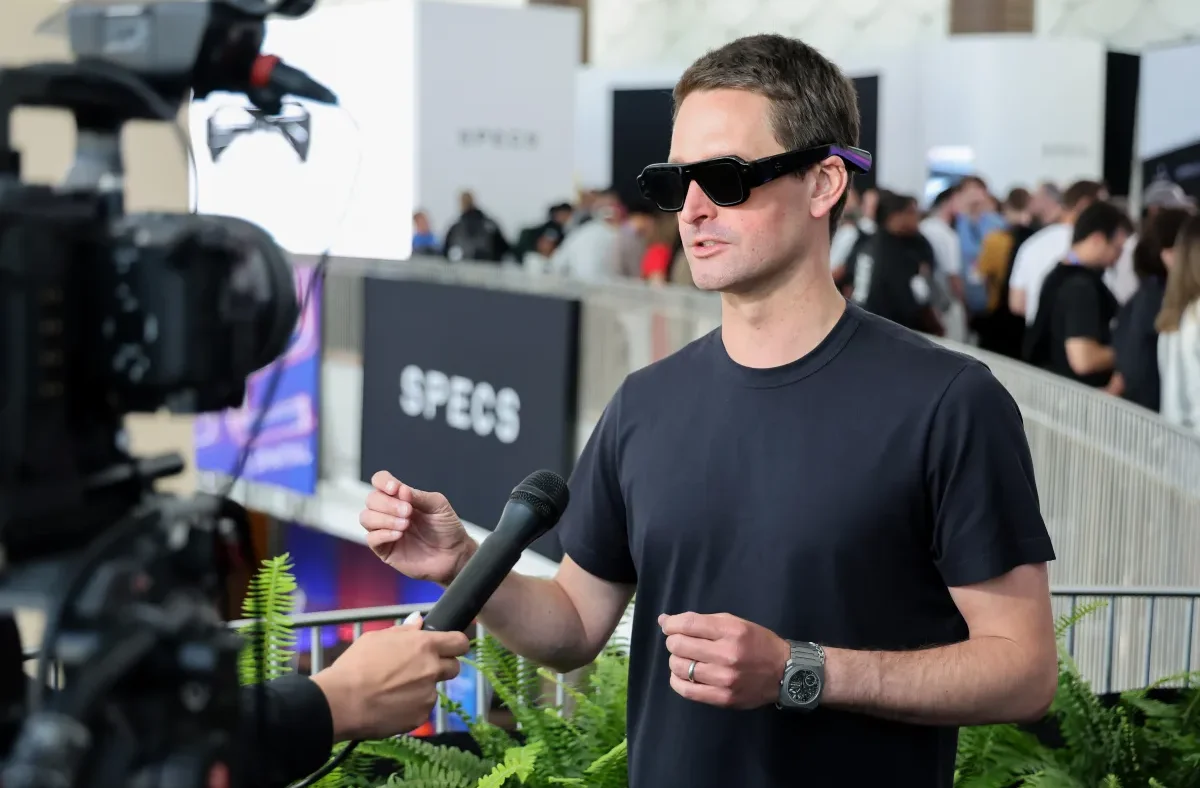 Snap CEO Evan Spiegel wearing the newly launched "Specs" AR glasses during an interview.
