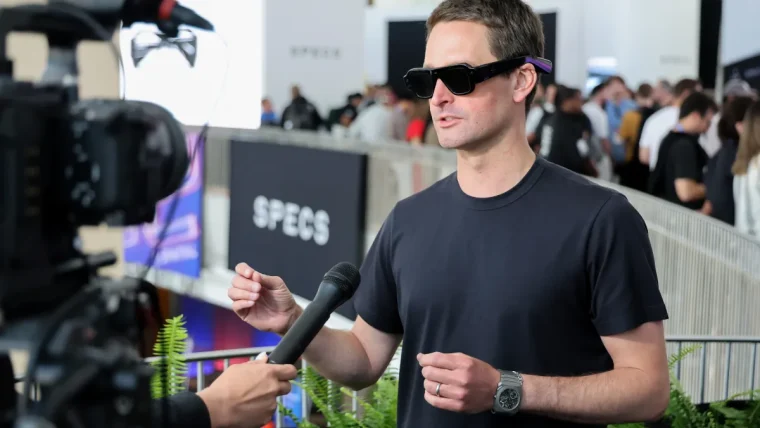 Snap CEO Evan Spiegel wearing the newly launched "Specs" AR glasses during an interview.