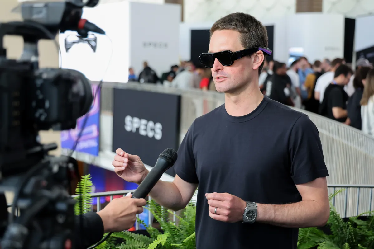 Snap CEO Evan Spiegel wearing the newly launched "Specs" AR glasses during an interview.