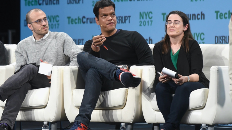 Sriram Krishnan, former White House AI advisor, at a podium discussing artificial intelligence policy.
