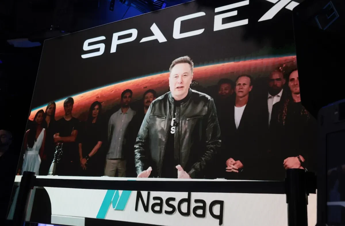 Elon Musk and SpaceX executives on the Nasdaq floor after the historic IPO