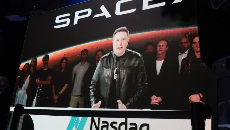 Elon Musk and SpaceX executives on the Nasdaq floor after the historic IPO