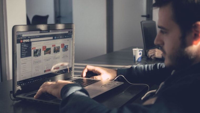 A laptop and phone showing AI-powered search results