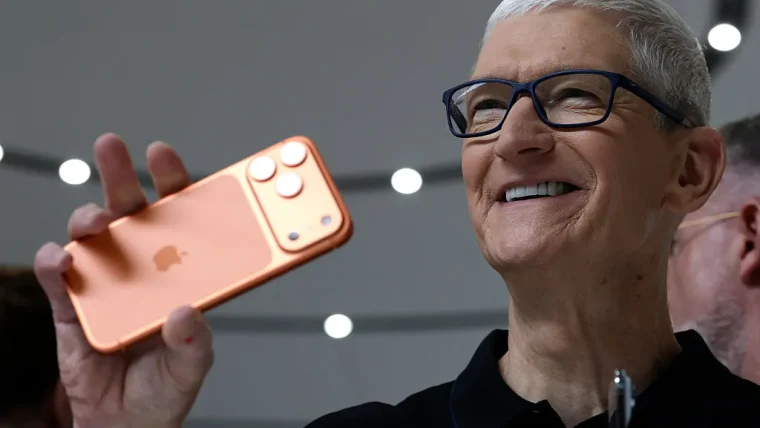 A person holding an iPhone, showcasing various practical AI features from iOS 27 like bill splitting on a receipt, smart suggestions in messages, and call context during a phone