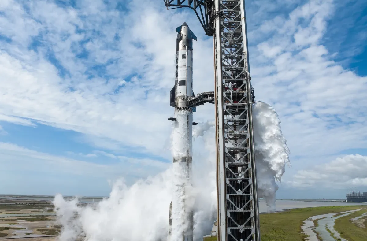 SpaceX Starship rocket on a launchpad with exhaust plumes