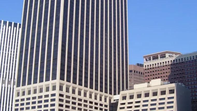 A graphic illustrating the S&P Global logo alongside the Oracle and OpenAI logos, symbolizing the credit rating downgrade.