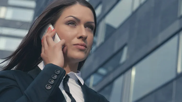 A smartphone displaying a generative AI chatbot interface, with a call icon suggesting business communication, illustrating the connection between AI and sales leads.