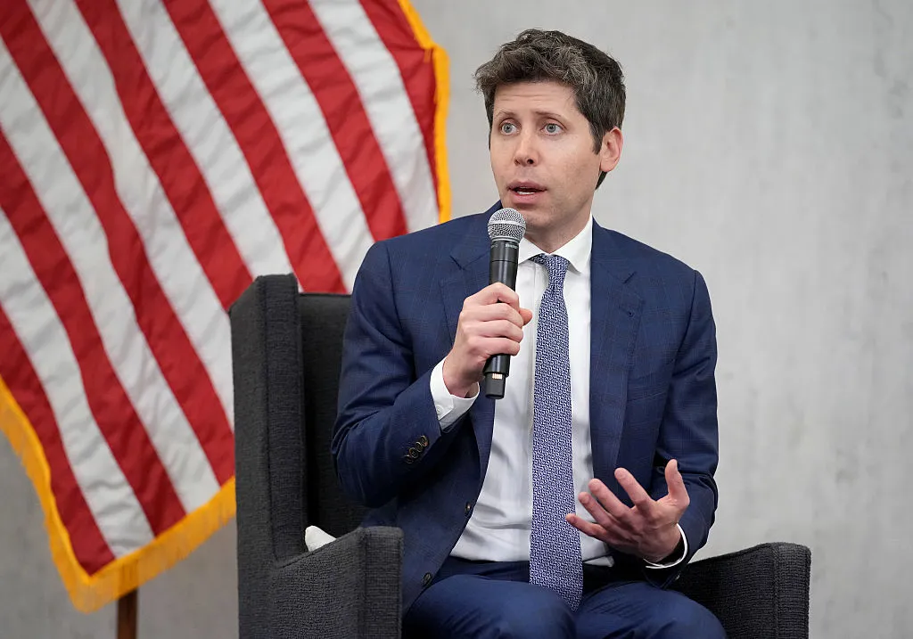 Sam Altman, CEO of OpenAI, speaking at a conference podium