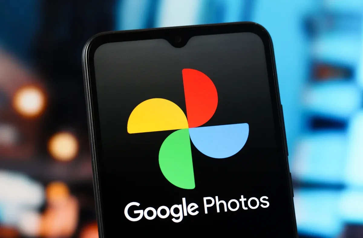 A smartphone screen showing Google Photos with an AI video remix interface, applying a watercolor effect to a video clip.