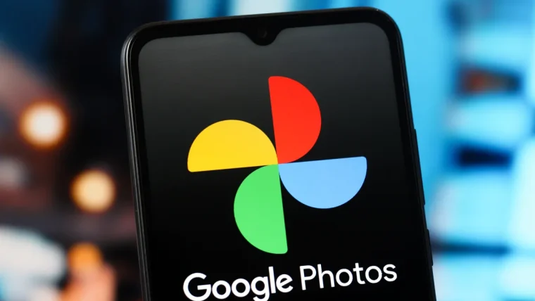 A smartphone screen showing Google Photos with an AI video remix interface, applying a watercolor effect to a video clip.