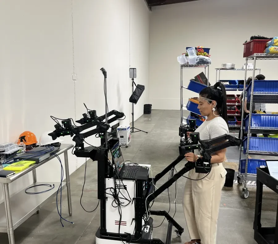 Andrew Ceja, a pilot at Encord, wears a Zander Labs headset that measures brain waves while he performs a physical task in a San Leandro warehouse.