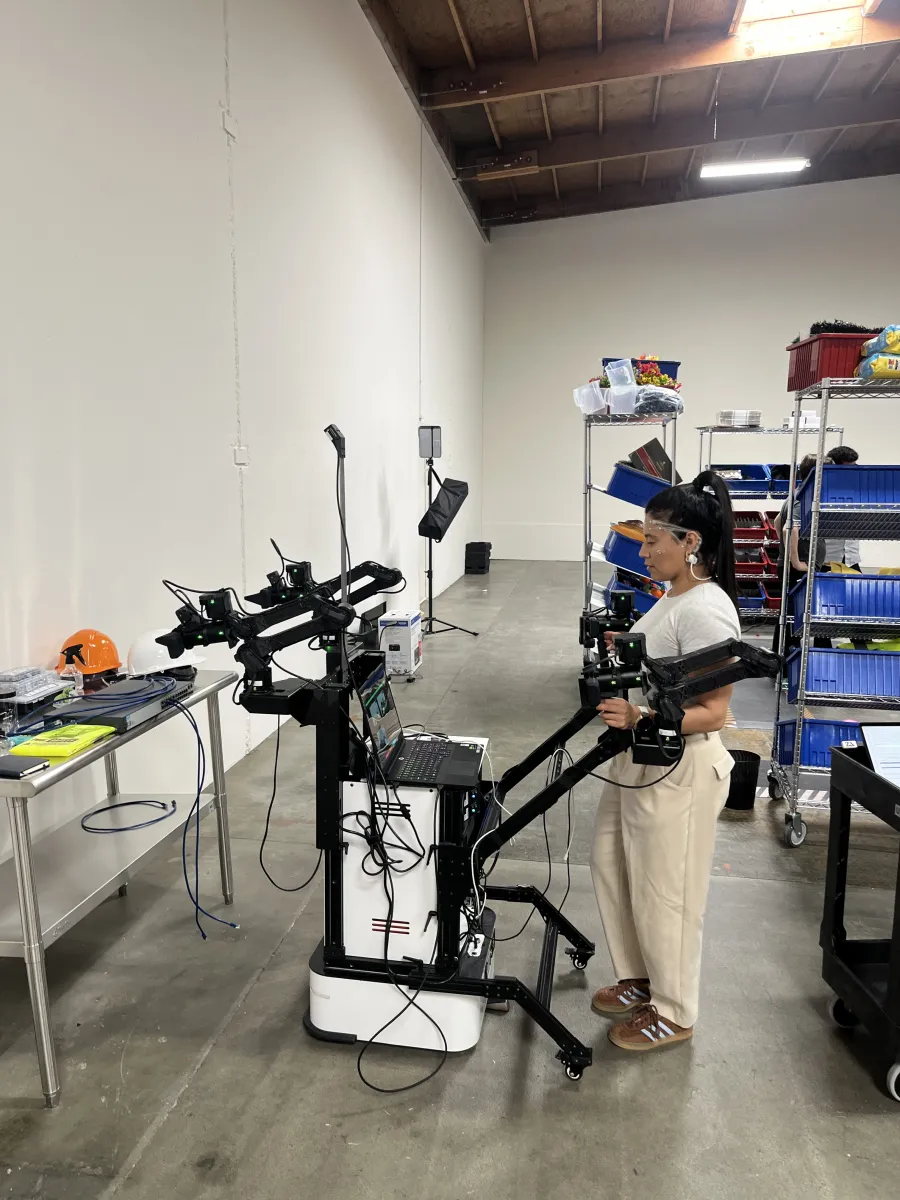 Andrew Ceja, a pilot at Encord, wears a Zander Labs headset that measures brain waves while he performs a physical task in a San Leandro warehouse.
