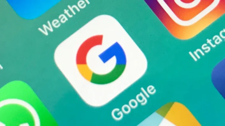 A person using a smartphone, looking at privacy settings for a Google app, with text indicating AI data usage.
