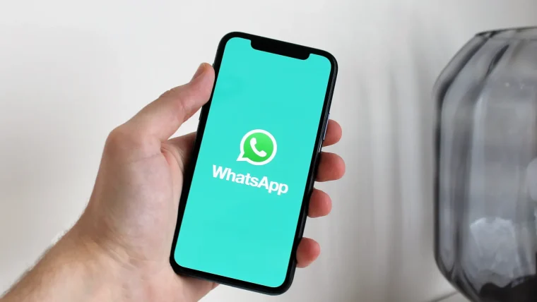 A small business owner using WhatsApp Business on a smartphone