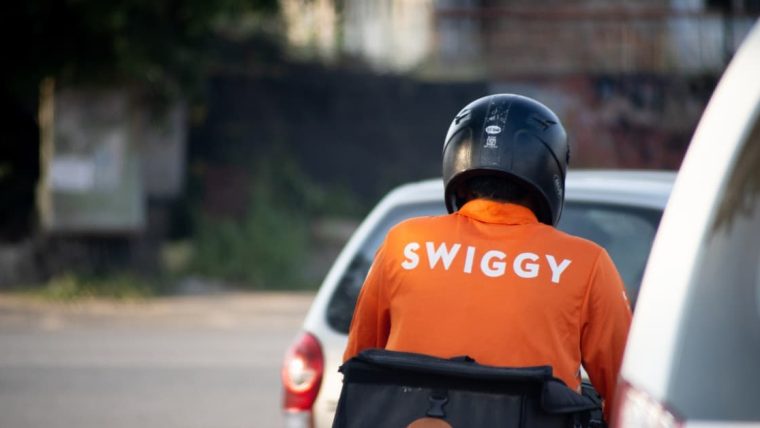 The FSSAI logo next to a Swiggy Instamart delivery bag, signifying regulatory action.