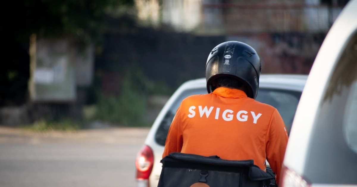 The FSSAI logo next to a Swiggy Instamart delivery bag, signifying regulatory action.